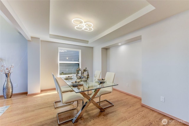 14531 86th Pl NE, Kenmore, WA 98028 - dining area featuring a raised ceiling and wood finished floors