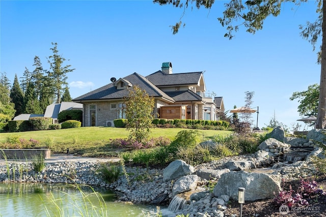 33020 84th Ave NW, Stanwood, WA 98292 - view of side of home featuring a lawn, a chimney, and stone siding