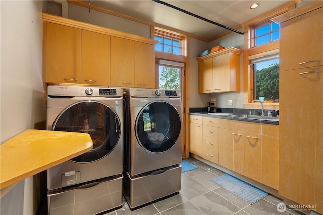 33020 84th Ave NW, Stanwood, WA 98292 - laundry room with cabinet space, independent washer and dryer, ornamental molding, and light tile patterned flooring