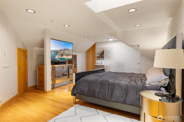 33020 84th Ave NW, Stanwood, WA 98292 - bedroom with light wood-style floors, a skylight, recessed lighting, lofted ceiling, and baseboards