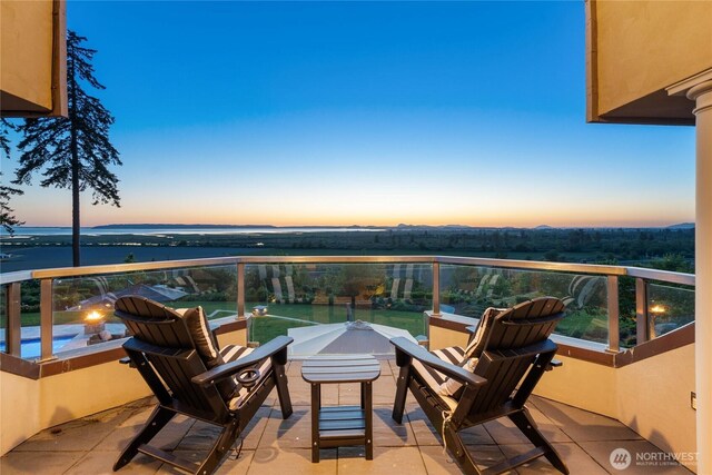 33020 84th Ave NW, Stanwood, WA 98292 - patio terrace at dusk featuring a balcony