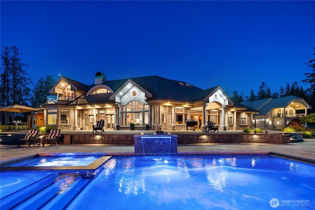 33020 84th Ave NW, Stanwood, WA 98292 - pool at twilight with an in-ground hot tub, a patio area, and an outdoor pool