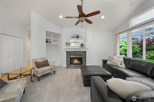 8122 104th Street Ct SW, Lakewood, WA 98498 - carpeted living area with ceiling fan, a fireplace, built in shelves, vaulted ceiling, and recessed lighting