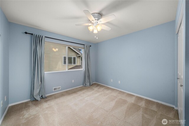 8122 104th Street Ct SW, Lakewood, WA 98498 - unfurnished room featuring carpet flooring, ceiling fan, and baseboards