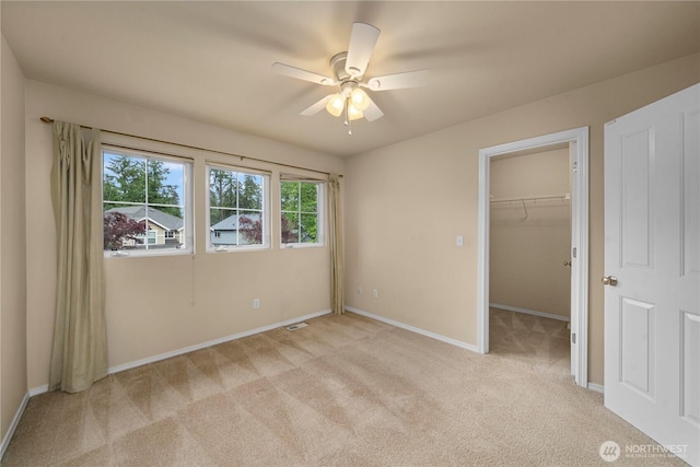8122 104th Street Ct SW, Lakewood, WA 98498 - unfurnished bedroom featuring light carpet, baseboards, a spacious closet, ceiling fan, and a closet