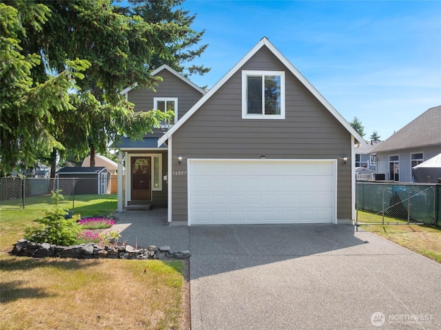 16807 20th Ave E, Spanaway, WA 98387 - traditional home featuring concrete driveway and a garage