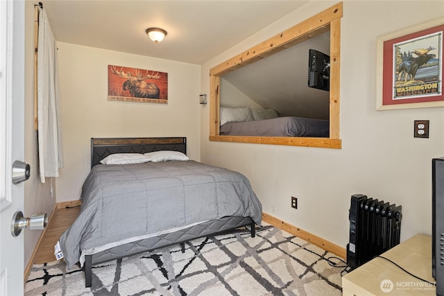131 Horse Heaven Rd, Cle Elum, WA 98922 - bedroom featuring baseboards, radiator, and wood finished floors