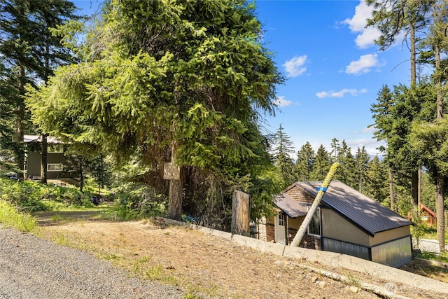 131 Horse Heaven Rd, Cle Elum, WA 98922 - view of side of home featuring metal roof and stone siding