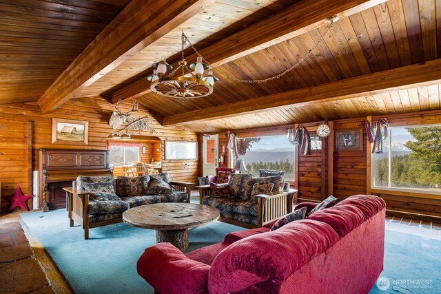 131 Horse Heaven Rd, Cle Elum, WA 98922 - living room with a chandelier, plenty of natural light, wooden walls, wooden ceiling, and carpet floors