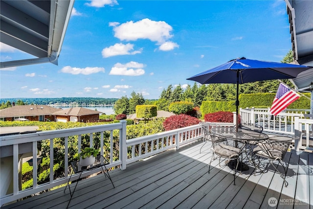 5819 18th Street Ct NW, Gig Harbor, WA 98335 - wooden terrace with a water view and outdoor dining area