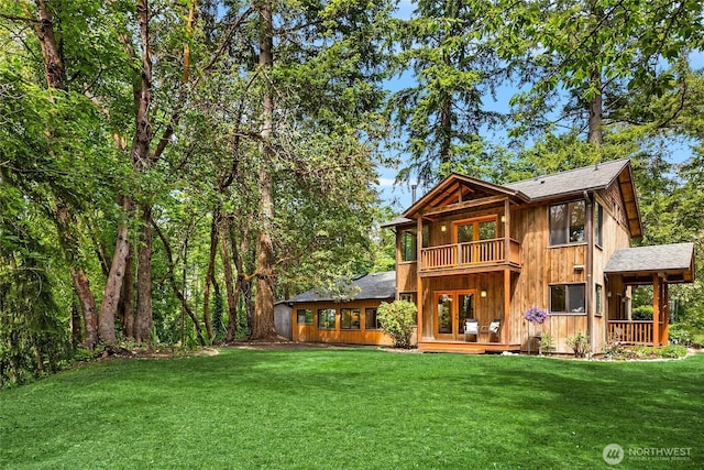 14427 Silven Ave NE, Bainbridge Island, WA 98110 - rear view of property featuring a balcony, a yard, french doors, and a shingled roof