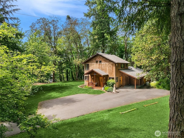 14427 Silven Ave NE, Bainbridge Island, WA 98110 - view of front of property featuring asphalt driveway, covered porch, a front yard, a chimney, and roof with shingles
