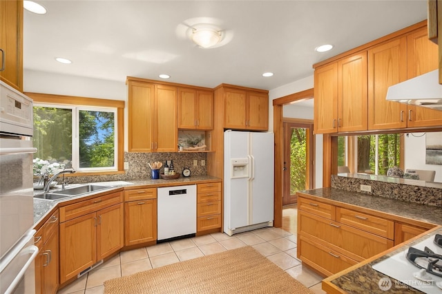 14427 Silven Ave NE, Bainbridge Island, WA 98110 - kitchen featuring white appliances, a sink, tile counters, light tile patterned floors, and backsplash