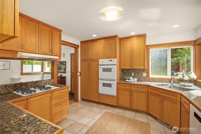 14427 Silven Ave NE, Bainbridge Island, WA 98110 - kitchen featuring white appliances, a sink, under cabinet range hood, healthy amount of natural light, and recessed lighting