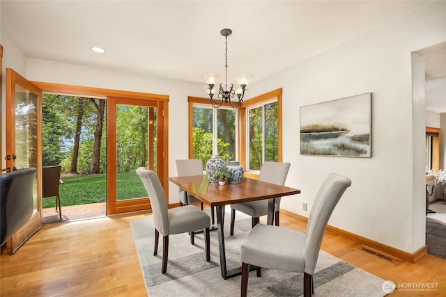 14427 Silven Ave NE, Bainbridge Island, WA 98110 - dining area with plenty of natural light, a chandelier, light wood-style floors, baseboards, and recessed lighting