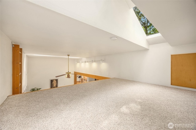 14427 Silven Ave NE, Bainbridge Island, WA 98110 - bonus room with a ceiling fan, carpet floors, and lofted ceiling