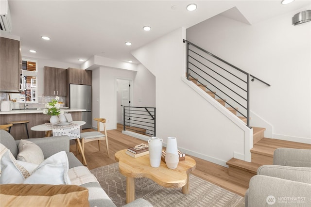 1206C NW 83rd St, Seattle, WA 98117 - living room with light wood-type flooring, recessed lighting, baseboards, and stairway