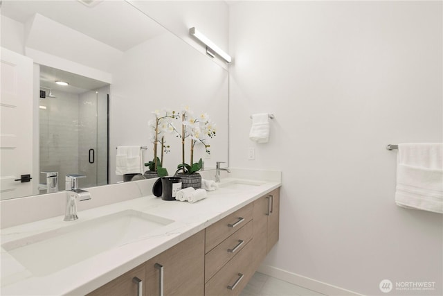 1206C NW 83rd St, Seattle, WA 98117 - full bathroom featuring double vanity, a shower stall, baseboards, and tile patterned floors