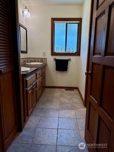 56 Westlake Rd, Oroville, WA 98844 - full bathroom featuring double vanity and baseboards