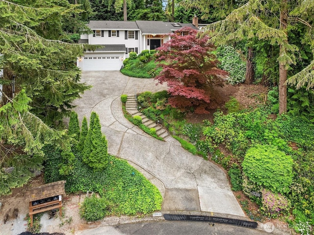 12810 NE 32nd Pl, Bellevue, WA 98005 - view of front of home featuring a garage, driveway, and a chimney