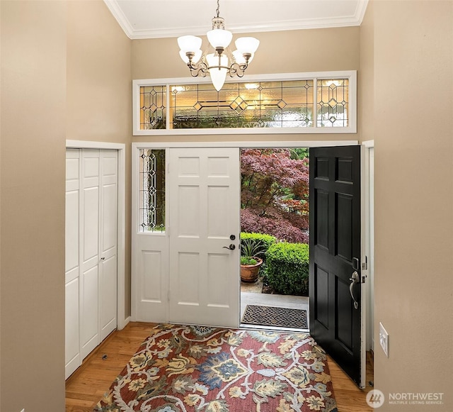 12810 NE 32nd Pl, Bellevue, WA 98005 - foyer featuring a chandelier, light wood finished floors, crown molding, and plenty of natural light