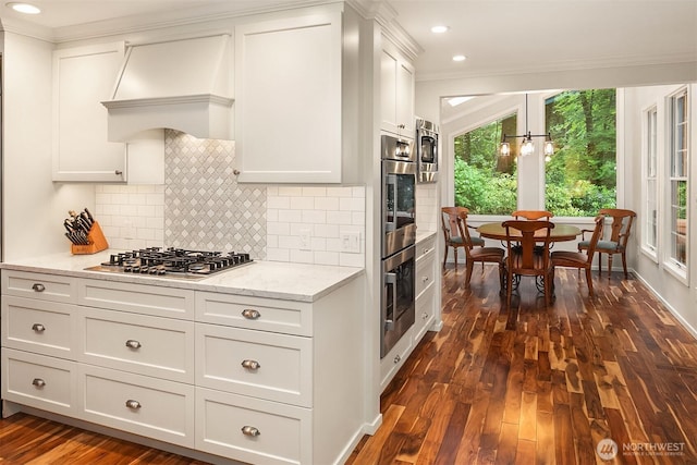 12810 NE 32nd Pl, Bellevue, WA 98005 - kitchen with stainless steel appliances, dark wood-type flooring, crown molding, tasteful backsplash, and light stone countertops