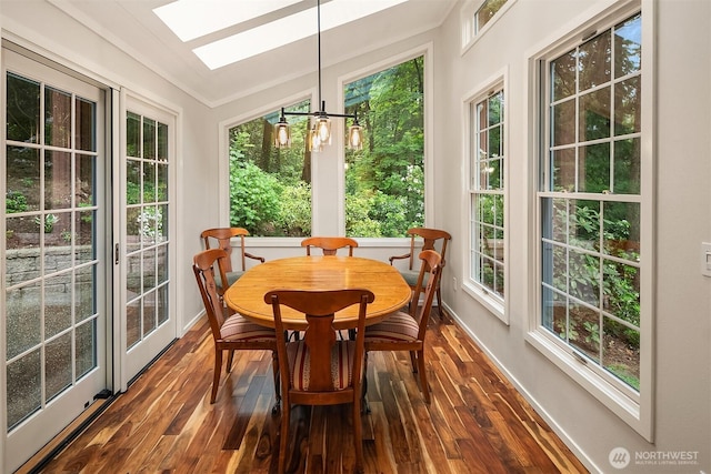 12810 NE 32nd Pl, Bellevue, WA 98005 - sunroom with a skylight, wood finished floors, baseboards, and vaulted ceiling
