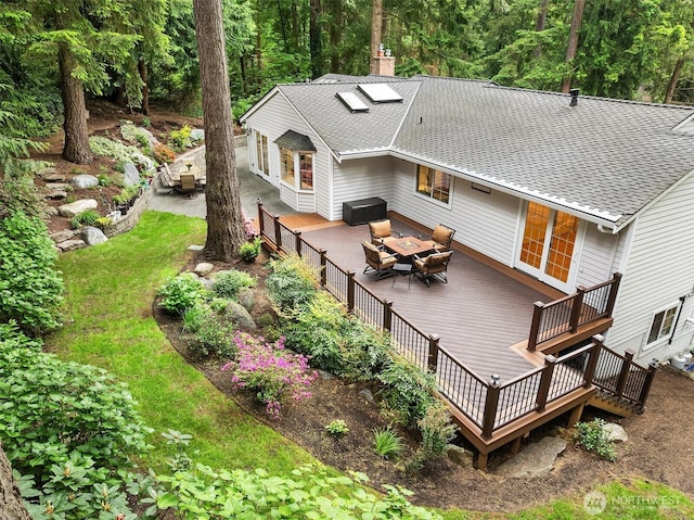 12810 NE 32nd Pl, Bellevue, WA 98005 - back of house featuring a shingled roof, a wooden deck, an outdoor living space, a chimney, and outdoor dining space