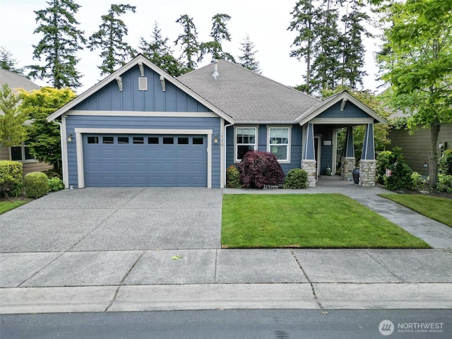 1770 SW Aberdeen Ct, Oak Harbor, WA 98277 - craftsman inspired home with an attached garage, a front yard, driveway, board and batten siding, and roof with shingles