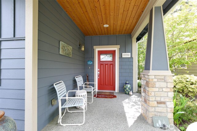 1770 SW Aberdeen Ct, Oak Harbor, WA 98277 - view of exterior entry featuring covered porch and board and batten siding