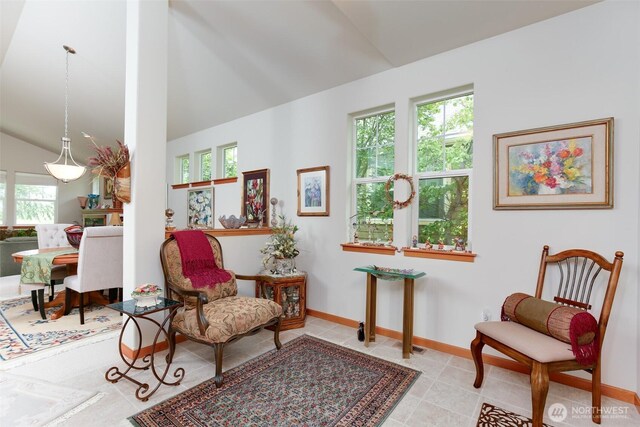 1770 SW Aberdeen Ct, Oak Harbor, WA 98277 - sitting room with healthy amount of natural light, vaulted ceiling, baseboards, and tile patterned floors