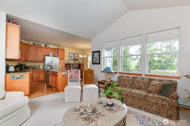 1770 SW Aberdeen Ct, Oak Harbor, WA 98277 - living area featuring lofted ceiling, light colored carpet, recessed lighting, and a chandelier