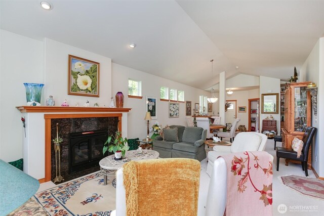 1770 SW Aberdeen Ct, Oak Harbor, WA 98277 - carpeted living area with a fireplace, vaulted ceiling, and recessed lighting