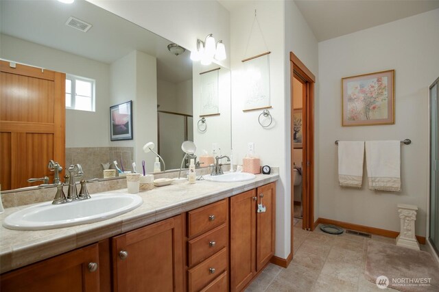 1770 SW Aberdeen Ct, Oak Harbor, WA 98277 - bathroom featuring double vanity, an enclosed shower, baseboards, and toilet