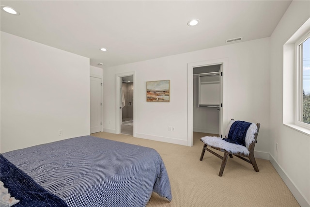 6730 21st Ave SW, Seattle, WA 98106 - bedroom featuring light carpet, recessed lighting, baseboards, and a walk in closet