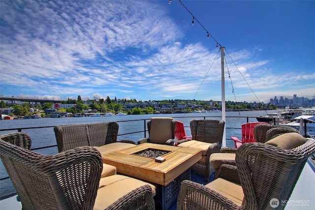 2401 N Northlake Way Unit B13, Seattle, WA 98103 - view of patio / terrace with a fire pit and a water view