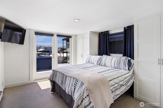 2401 N Northlake Way Unit B13, Seattle, WA 98103 - bedroom with access to exterior, baseboards, carpet flooring, a baseboard radiator, and recessed lighting