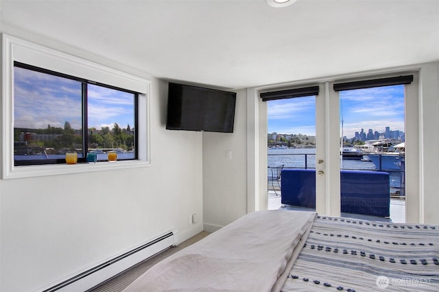 2401 N Northlake Way Unit B13, Seattle, WA 98103 - bedroom featuring baseboard heating, access to exterior, and baseboards