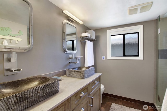 2401 N Northlake Way Unit B13, Seattle, WA 98103 - full bath with toilet, baseboards, vanity, and an enclosed shower