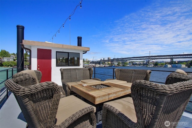 2401 N Northlake Way Unit B13, Seattle, WA 98103 - wooden terrace with a water view and outdoor lounge area