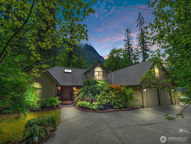 44611 SE 72nd St, Snoqualmie, WA 98065 - view of front of property with driveway, a shingled roof, and an attached garage