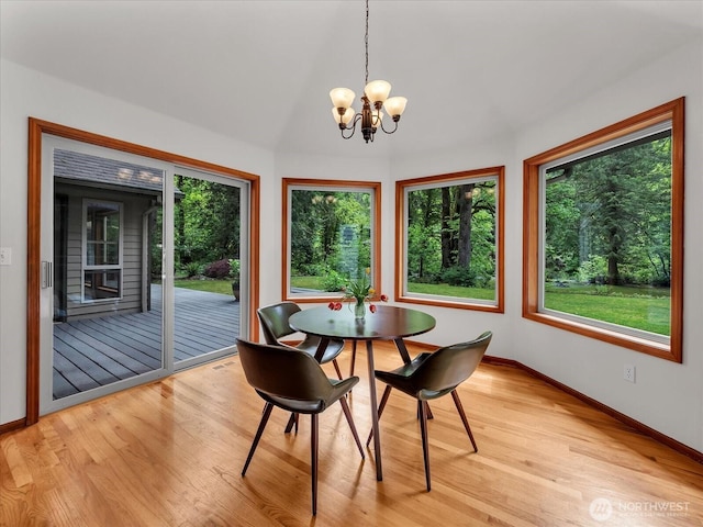 44611 SE 72nd St, Snoqualmie, WA 98065 - dining area with a chandelier, light wood-style floors, and baseboards