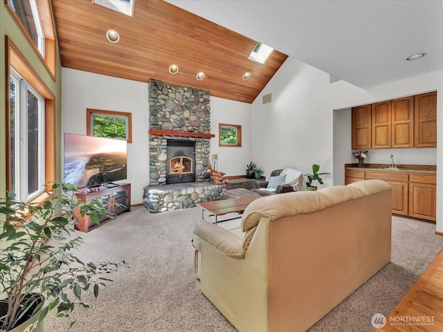 44611 SE 72nd St, Snoqualmie, WA 98065 - living area featuring a fireplace, high vaulted ceiling, a skylight, recessed lighting, and light colored carpet