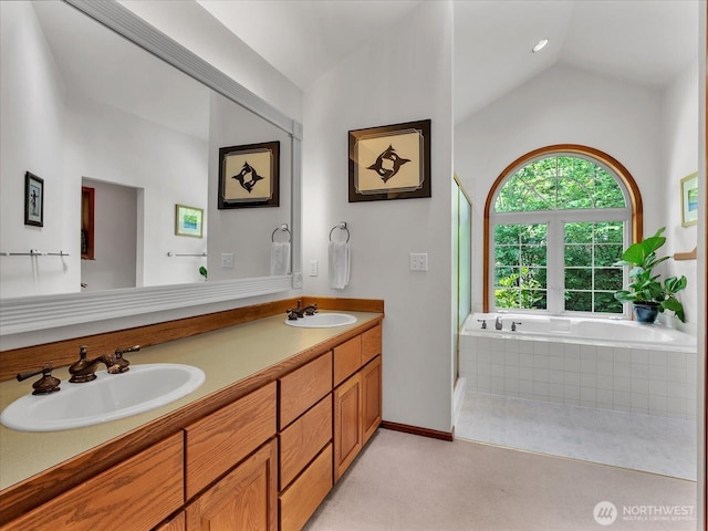 44611 SE 72nd St, Snoqualmie, WA 98065 - bathroom with vaulted ceiling, double vanity, a bath, a shower stall, and baseboards