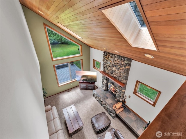 44611 SE 72nd St, Snoqualmie, WA 98065 - carpeted living room featuring a skylight, wooden ceiling, and a fireplace
