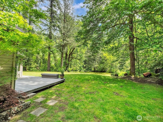 44611 SE 72nd St, Snoqualmie, WA 98065 - view of green lawn with a wooden deck