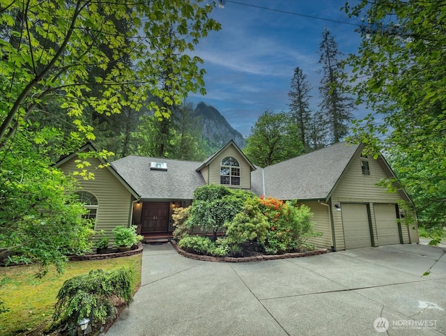 44611 SE 72nd St, Snoqualmie, WA 98065 - view of front of home featuring a garage, driveway, and roof with shingles