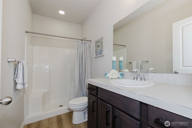 9422 Fairhaven Cir NE, Bremerton, WA 98311 - bathroom featuring vanity, toilet, wood finished floors, and a shower with shower curtain