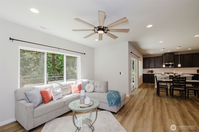 9422 Fairhaven Cir NE, Bremerton, WA 98311 - living room featuring light wood-type flooring, ceiling fan, recessed lighting, and baseboards