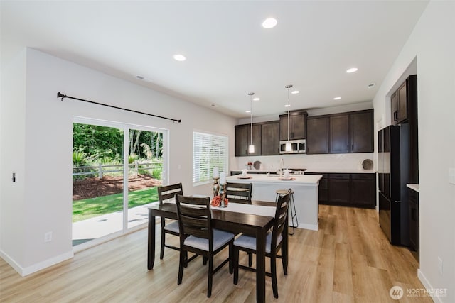 9422 Fairhaven Cir NE, Bremerton, WA 98311 - dining room featuring light wood-style flooring, recessed lighting, and baseboards